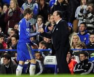Chelsea's Fernando Torres (L) shakes hands with interim manager Rafael Benitez at Stamford Bridge on January 9, 2013